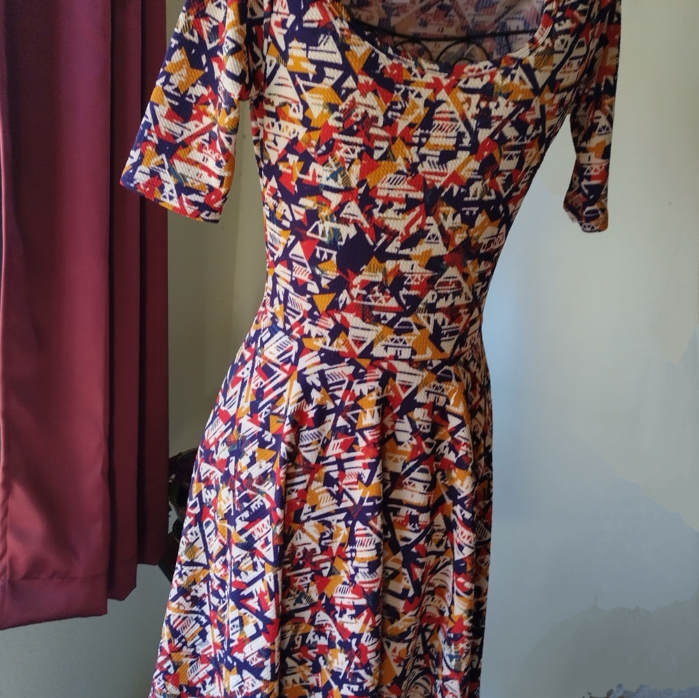 Two Lula Roe mid length casual dresses. Size small.